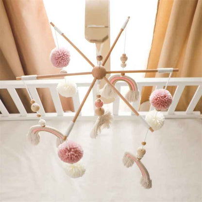 Support mobile bébé bohème en bois et laine arc-en-ciel rose poudré – décoration chambre bébé naturelle